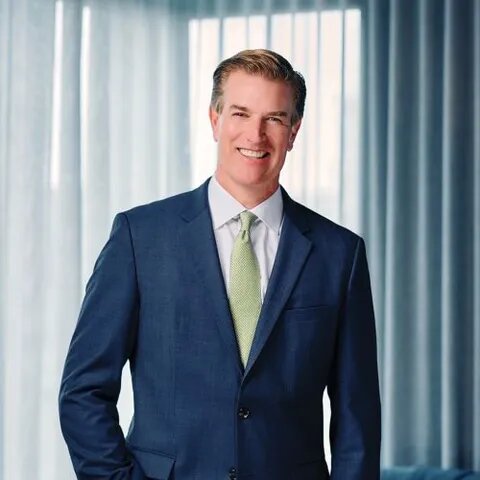 Professional portrait of a real estate agent in a suit representing Daryl Judy Washington Fine Properties